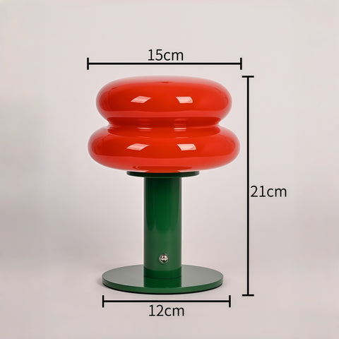 cream-style glass egg-tart lamp glowing with soft warm light from Gallery of Use