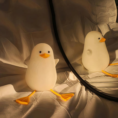 sitting quack night lamp lighting up gently on a desk from Gallery of Use