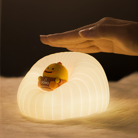 cute sofa-shaped silicone tap night light displayed indoors from Gallery of Use