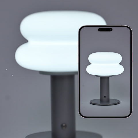 cream-style glass egg-tart lamp glowing with soft warm light from Gallery of Use