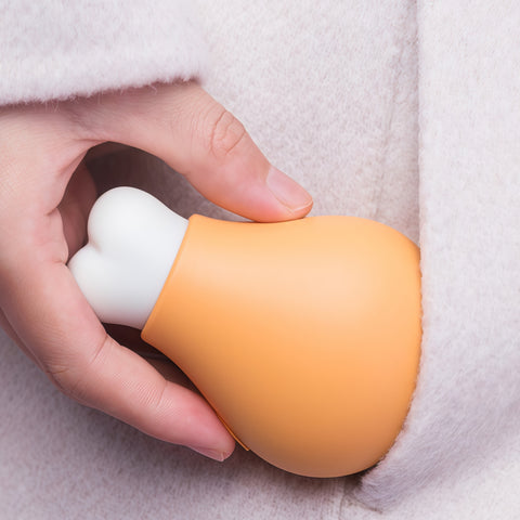 cute drumstick hand warmer carried in hand during cold outdoor moment from Gallery of Use