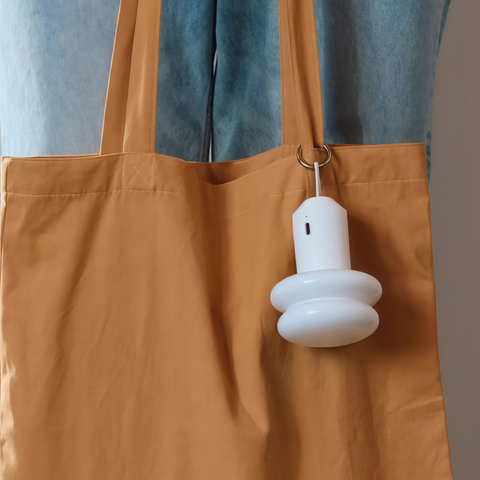 IK Snowman portable lamp casting a gentle warm glow