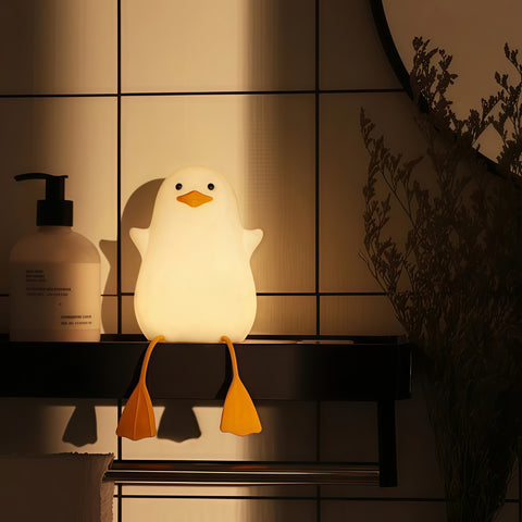 sitting quack night lamp lighting up gently on a desk from Gallery of Use