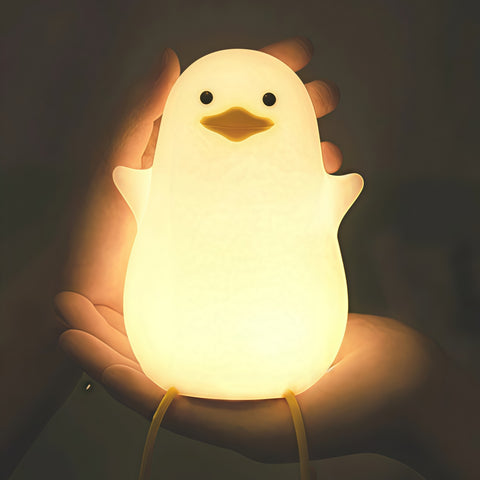 sitting quack night lamp lighting up gently on a desk from Gallery of Use
